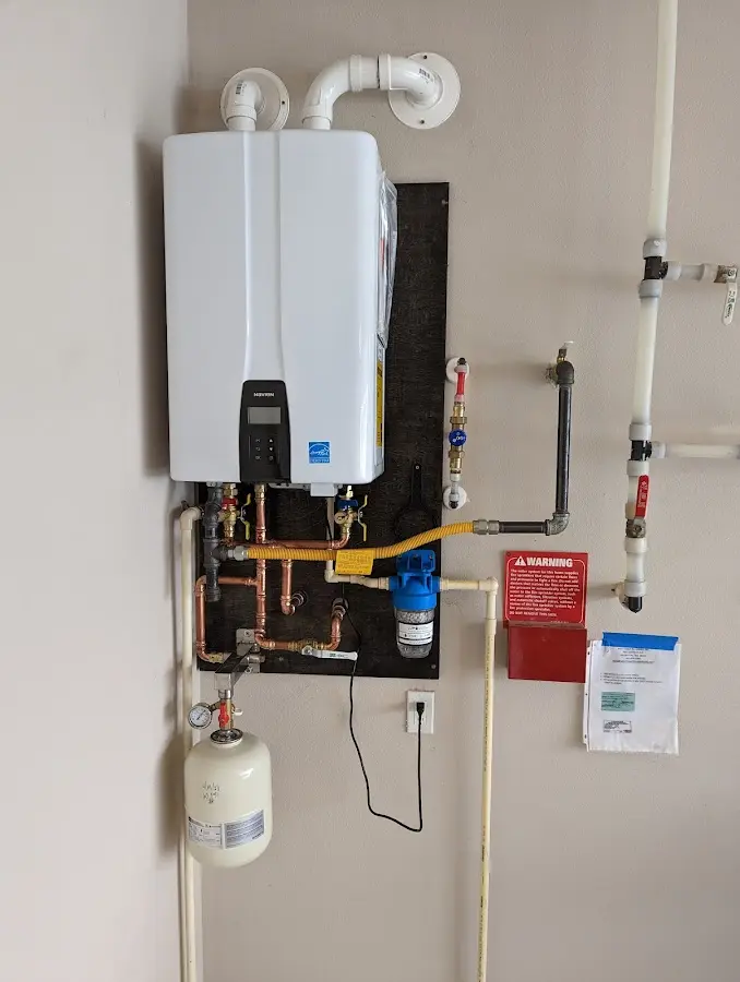 Professional plumber installing copper piping in a Bethesda home